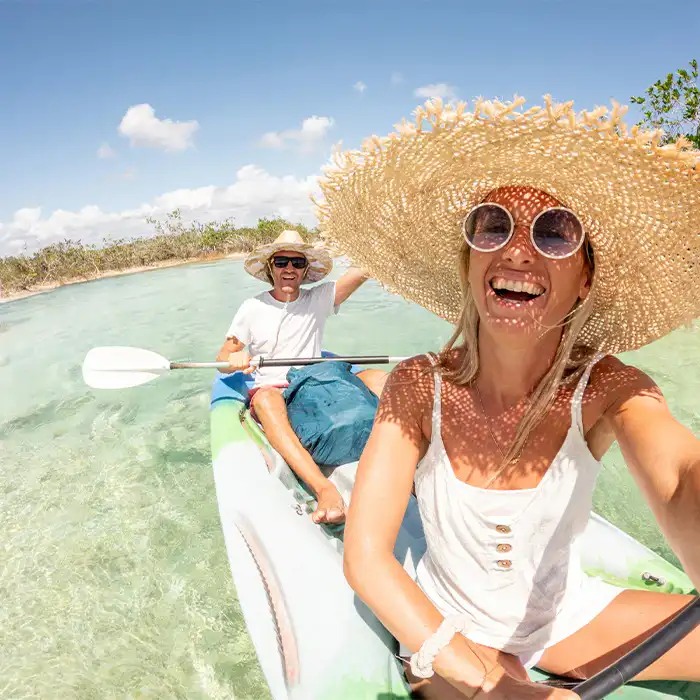 A couple kayaking in the calm waters of Cancun