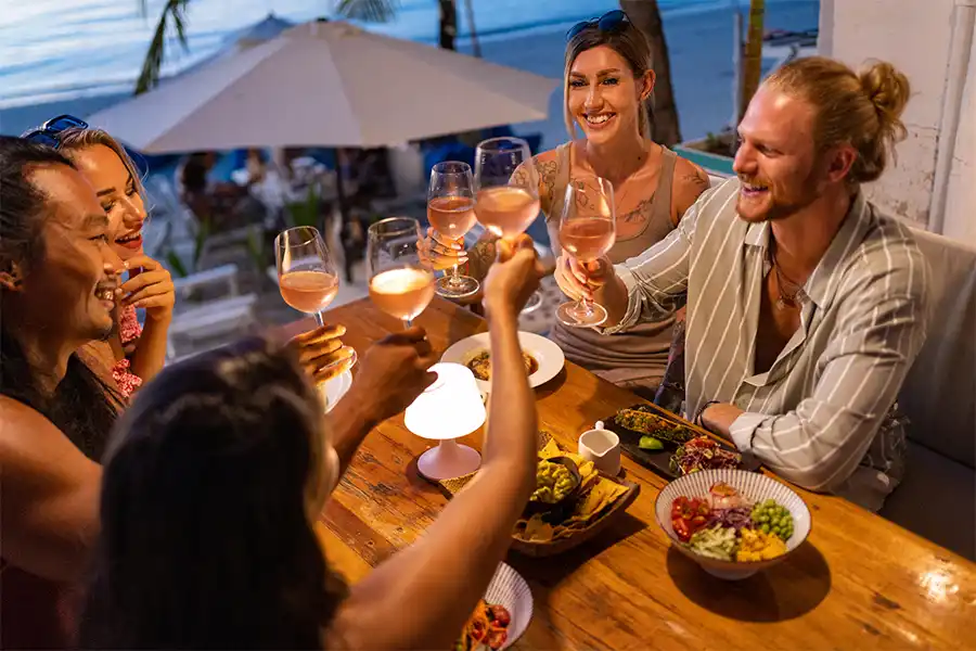 Friends having a great time at an elegant restaurant in Cancun